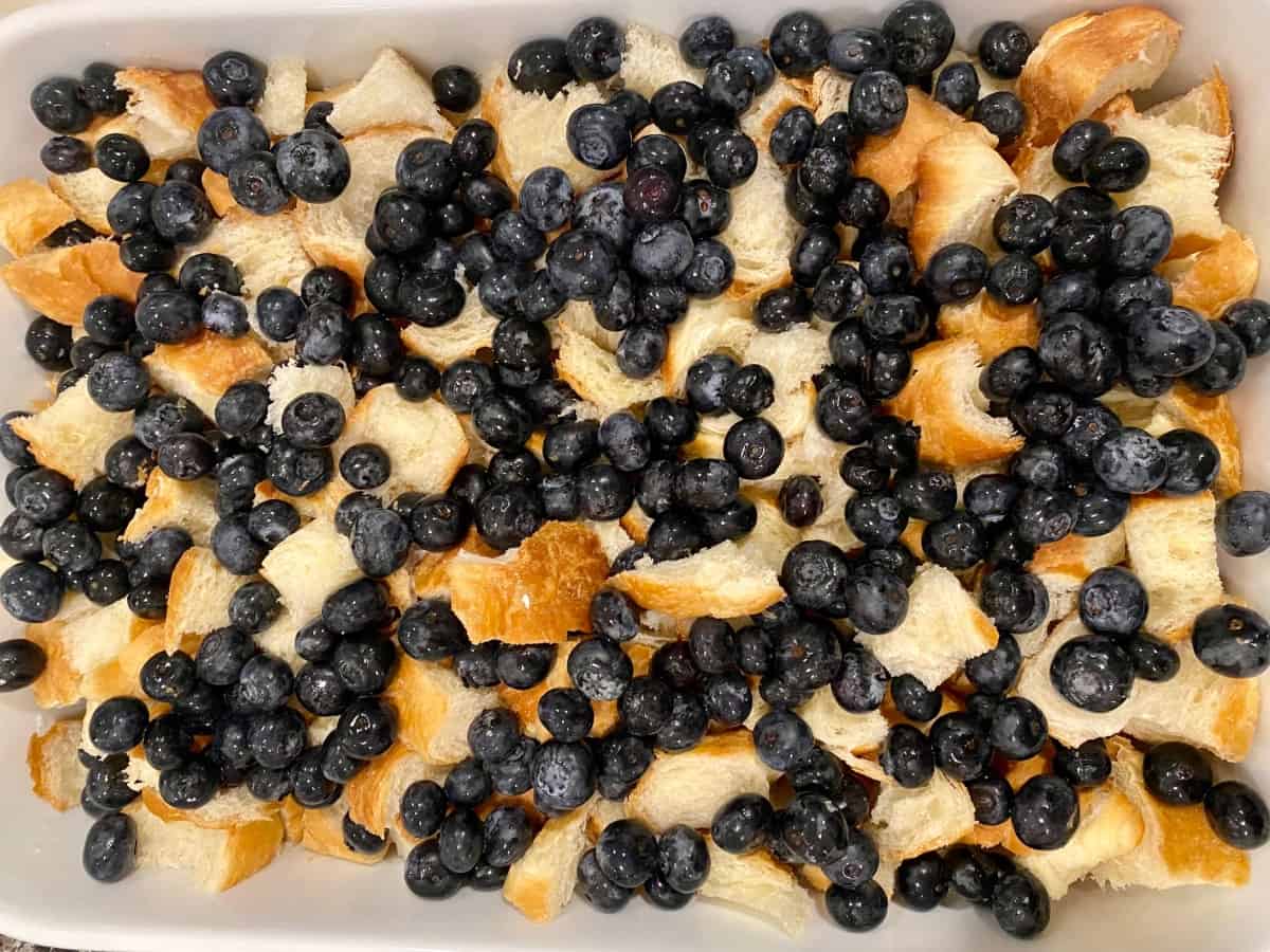 croissant and blueberries in a baking pan