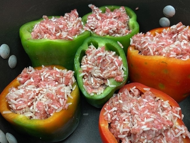 Dairy free stuffed peppers in a Dutch Oven on the stovetop